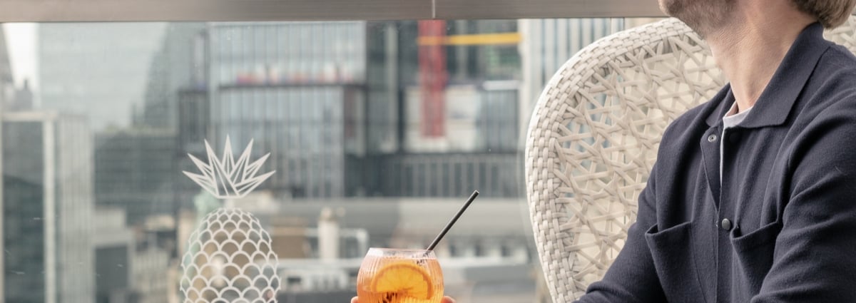 guest enjoying cocktail at Jin Bo Law