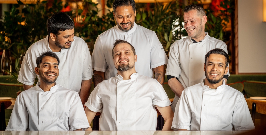 A group of chefs in white chefs coats